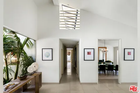 a view of a livingroom with furniture and a window