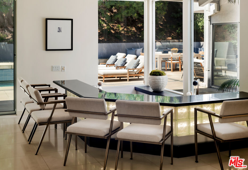 811 North Hillcrest Road Beverly Hills, CA 90210 - Photo 9 of 28 a dining room with furniture and window