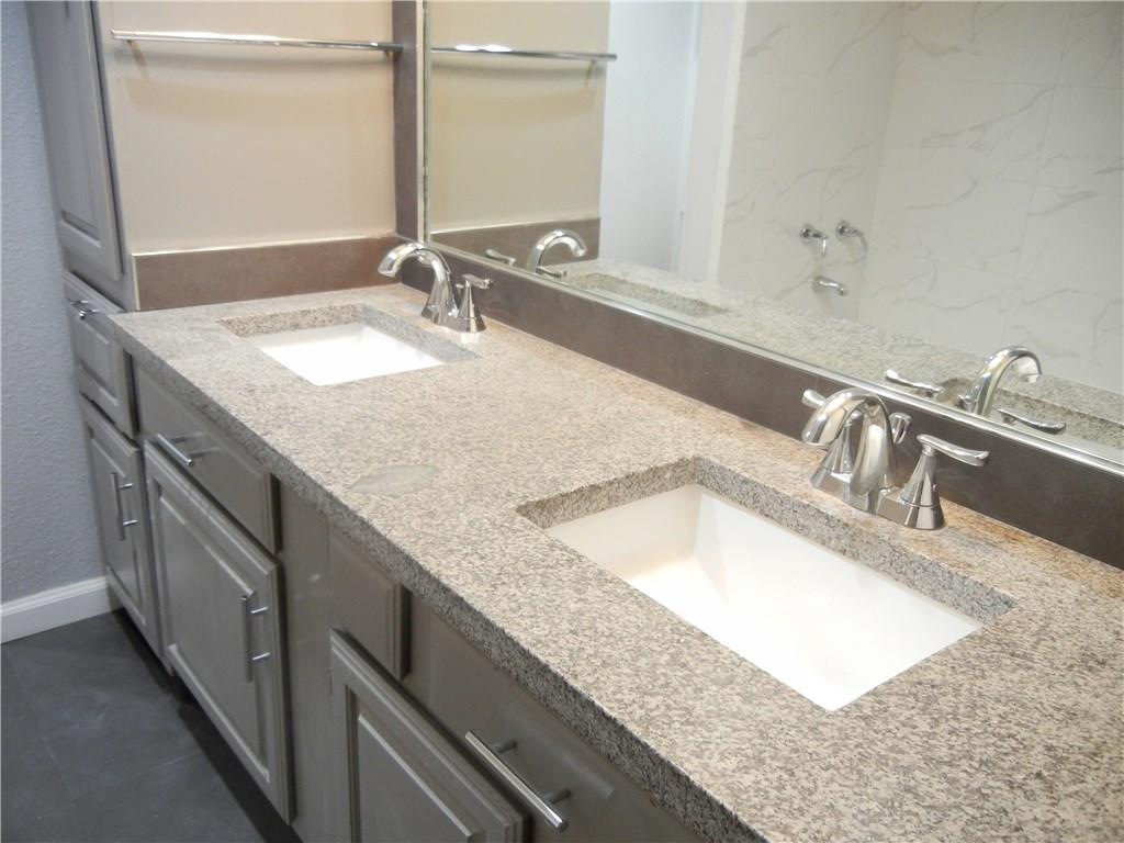 18240 Midway Road, Unit 105 Dallas, TX 75287 - Photo 18 of 37 a bathroom with double vanity and a sink