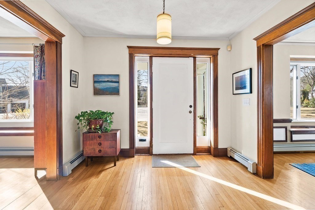5 Kelveden Road Newton, MA 02468 - Photo 3 of 32 a view of an entryway with wooden floor and a livingroom