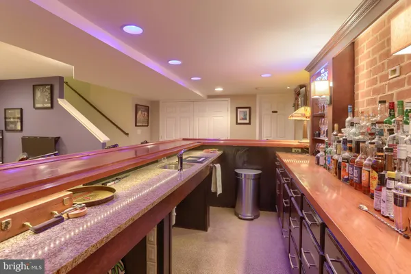 a kitchen with stainless steel appliances granite countertop a sink counter space and a stove