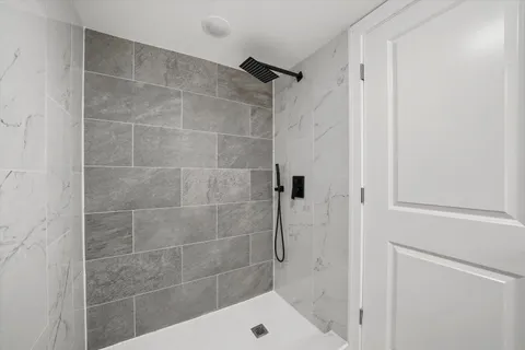 a bathroom with a shower and a bathtub