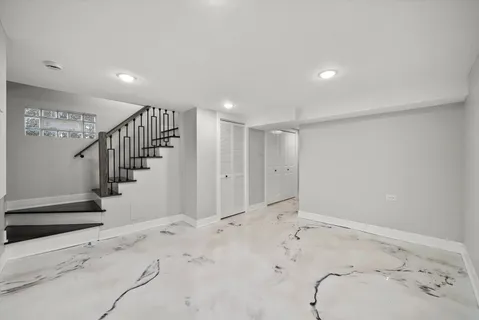 a view of a hallway with stairs