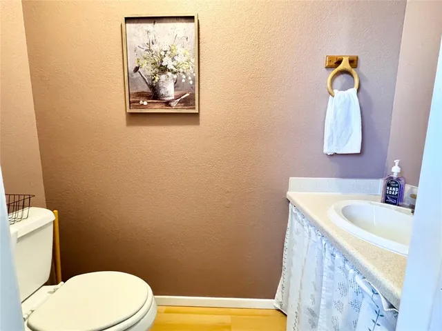 a bathroom with a toilet and a sink