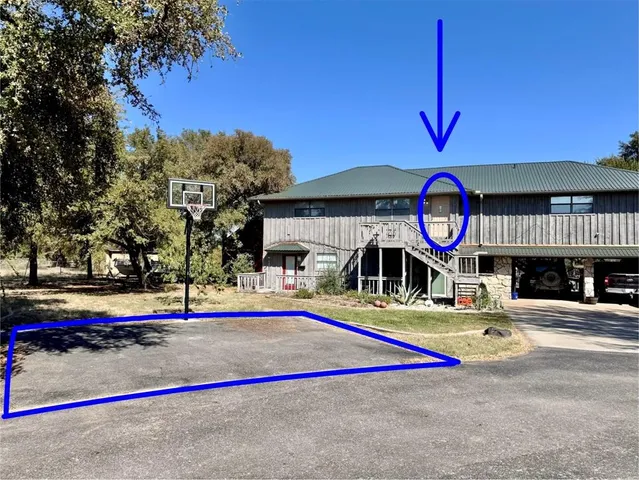 a view of a park with large trees