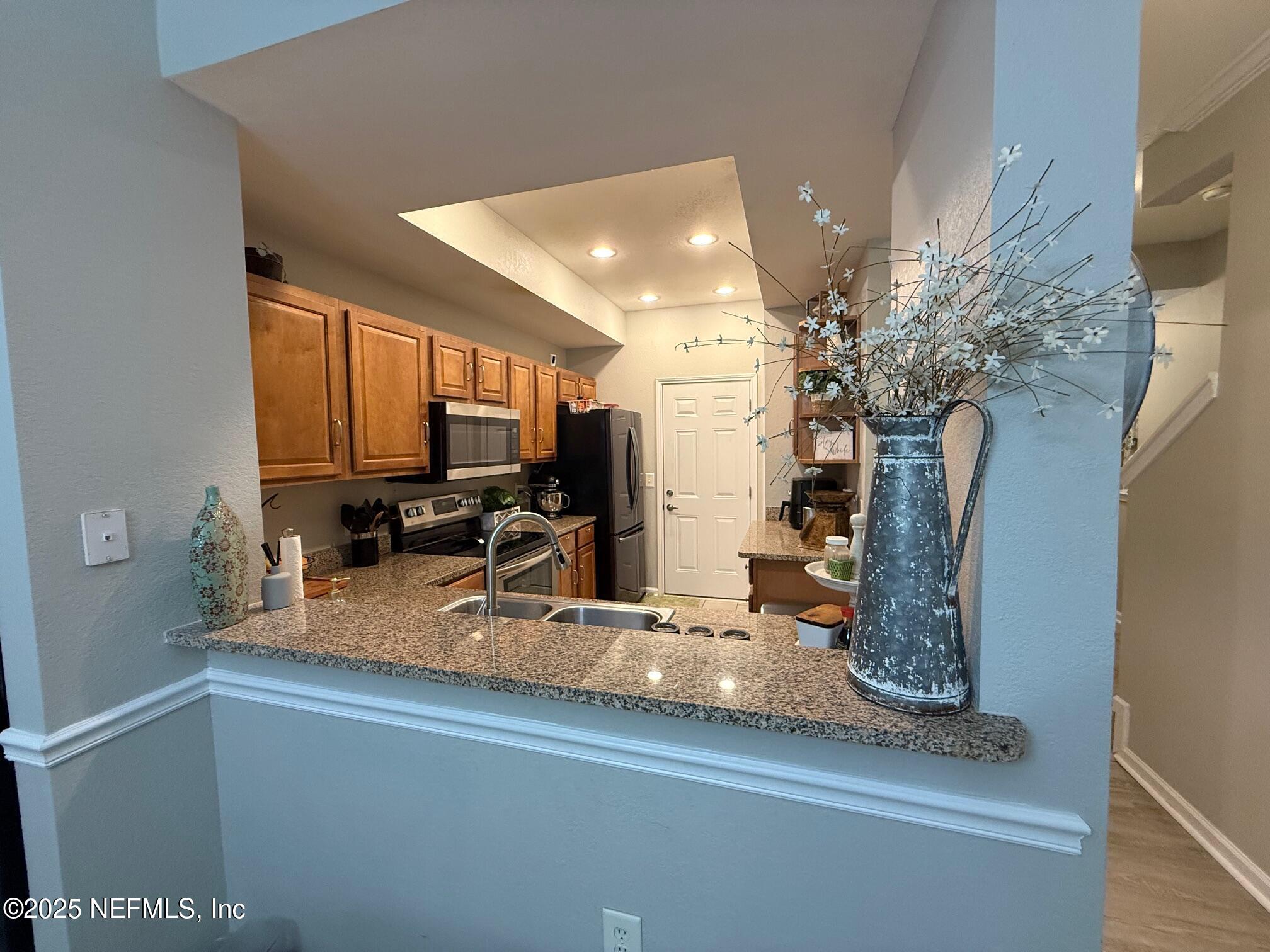 10200 Belle Rive Boulevard, Unit 4905 Jacksonville, FL 32256 - Photo 10 of 25 a view of a living room and dining room