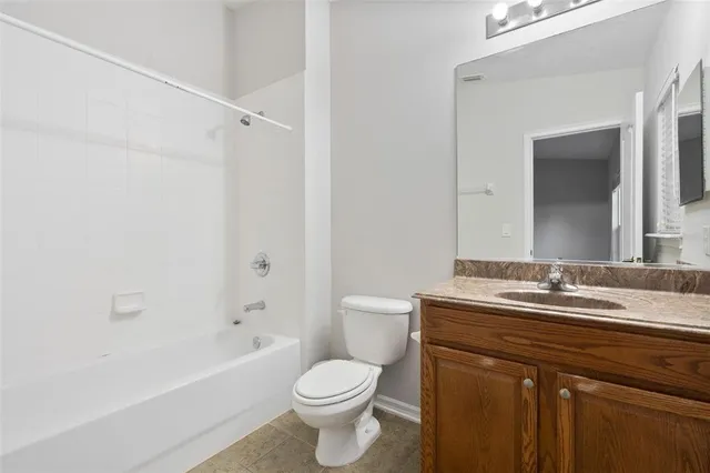 a bathroom with a sink a toilet and a bathtub