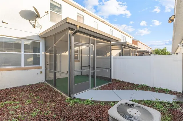 a balcony with table and chairs