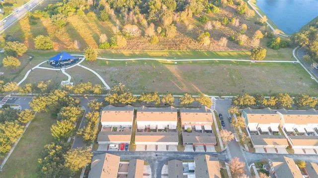 a view of swimming pool with a floor to ceiling window and wooden floor