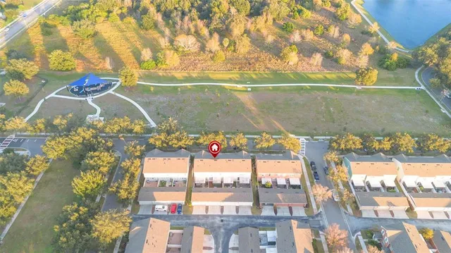 a view of swimming pool with a floor to ceiling window and outdoor space