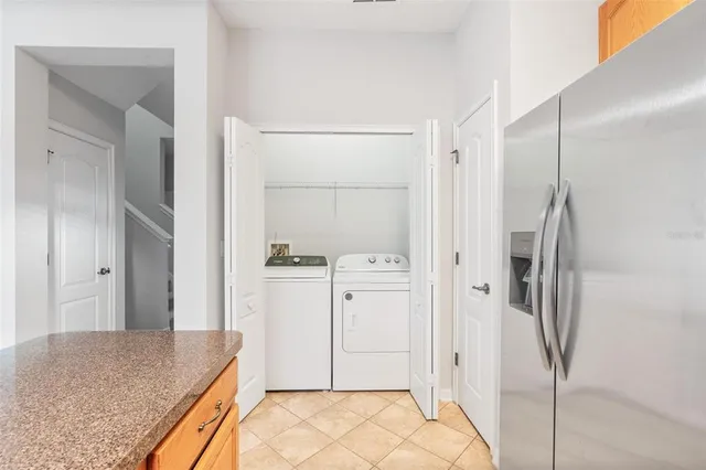a spacious bathroom with a granite countertop sink and shower