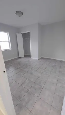 a view of an empty room and window