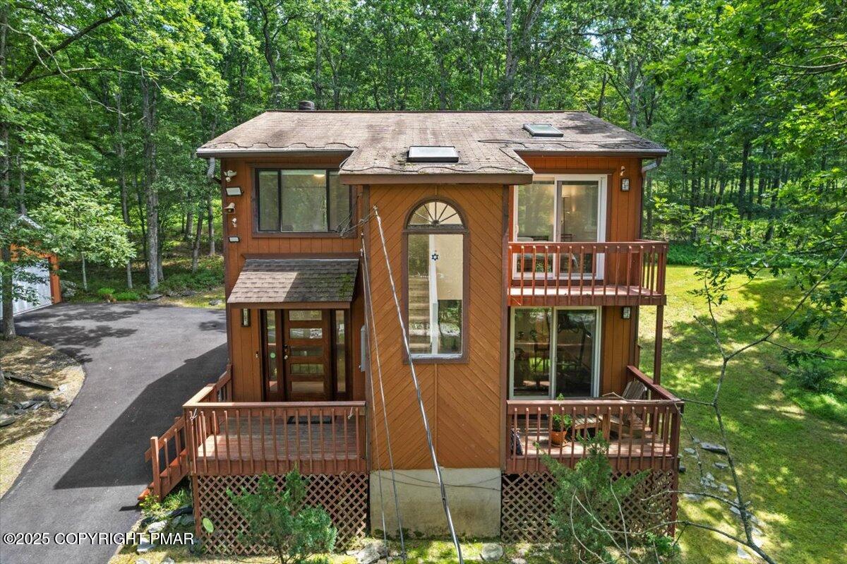 1289 Bear Drive Bushkill, PA 18324 - Photo 13 of 40 a front view of a house with a garden