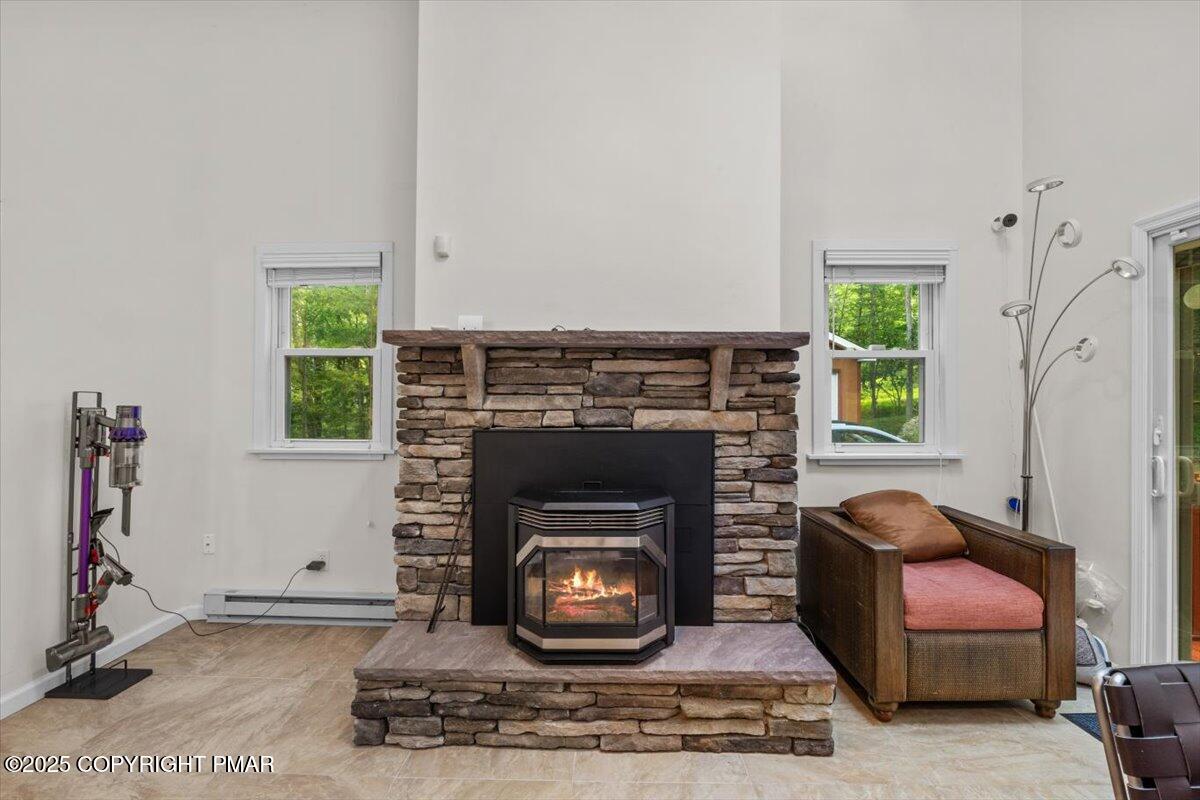 1289 Bear Drive Bushkill, PA 18324 - Photo 16 of 40 a living room with furniture and a fireplace
