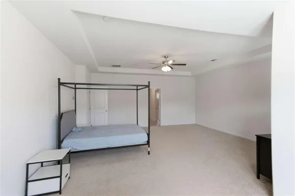 a very nice looking room with a ceiling fan