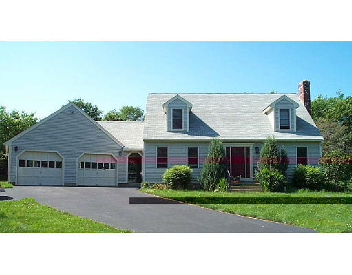 138 Chace Hill Road Sterling, MA 01564 - Photo 1 of 1 a front view of a house with a yard and garage