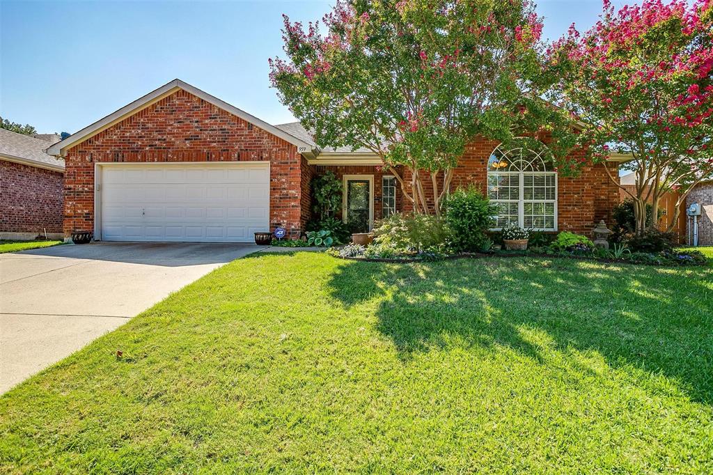 959 Benjamin Drive Burleson, TX 76028 - Photo 1 of 1 a front view of a house with a yard and garage