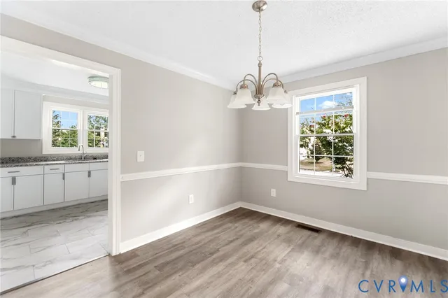 a view of a room with a windows and wooden floor