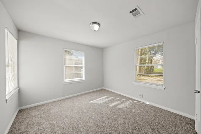 a bathroom with a toilet a sink and bathtub