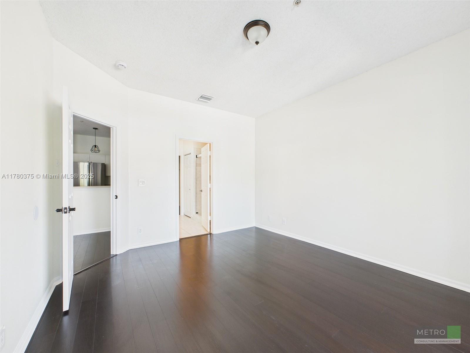 112 Lighthouse Circle, Unit H Tequesta, FL 33469 - Photo 11 of 20 a view of a room with wooden floor
