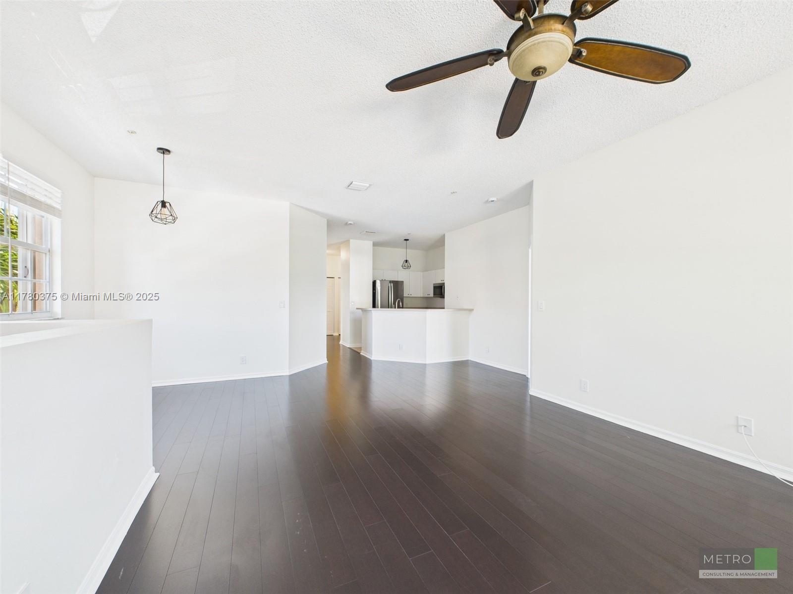 112 Lighthouse Circle, Unit H Tequesta, FL 33469 - Photo 6 of 20 a view of a kitchen with a dishwasher cabinets and wooden floor