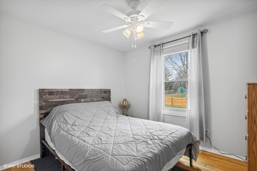 844 Burning Trail Carol Stream, IL 60188 - Photo 11 of 21 a bedroom with a bed and a window
