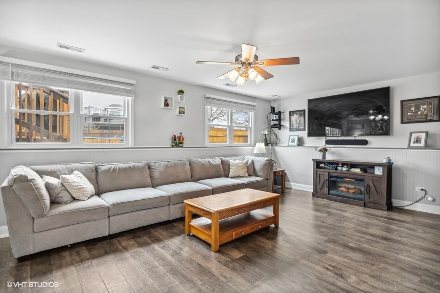 844 Burning Trail Carol Stream, IL 60188 - Photo 15 of 21 a living room with furniture flat screen tv and wooden floor