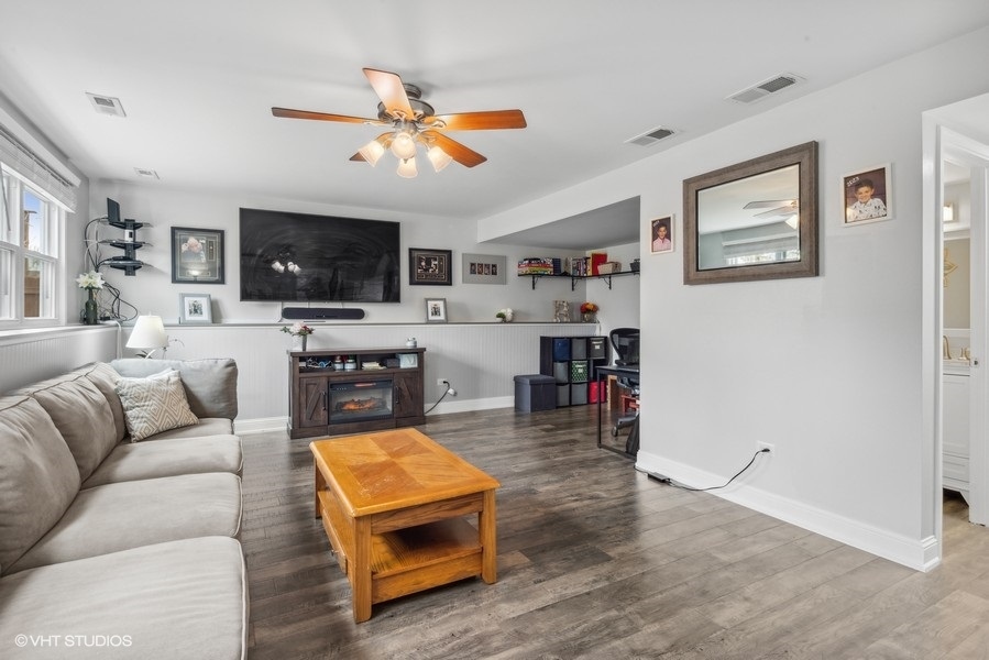 844 Burning Trail Carol Stream, IL 60188 - Photo 16 of 21 a living room with furniture and a flat screen tv