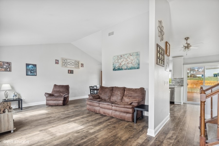 844 Burning Trail Carol Stream, IL 60188 - Photo 5 of 21 a living room with furniture and a fireplace