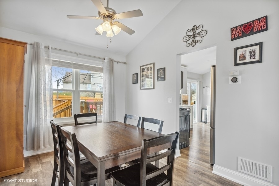 844 Burning Trail Carol Stream, IL 60188 - Photo 6 of 21 a view of a dining room with furniture window and wooden floor