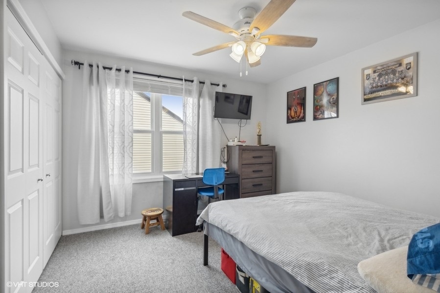 844 Burning Trail Carol Stream, IL 60188 - Photo 10 of 21 a bedroom with a bed dresser and a window