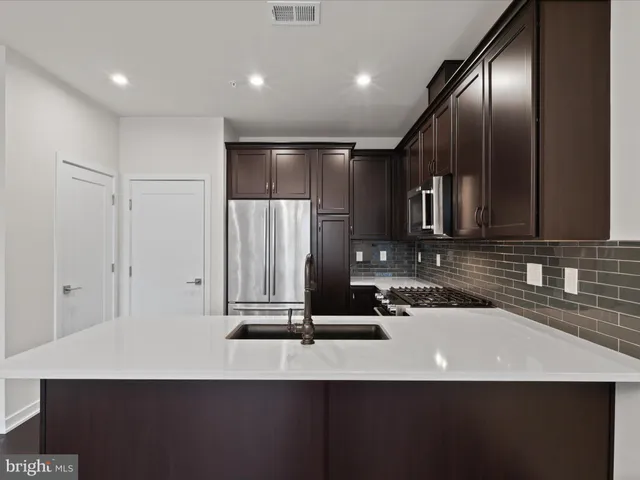 a view of a kitchen with a sink