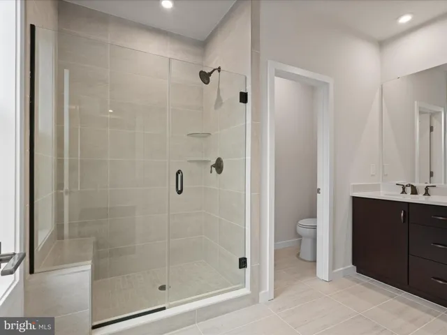 a bathroom with a shower and a sink