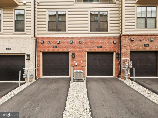 a front view of a house with a garage