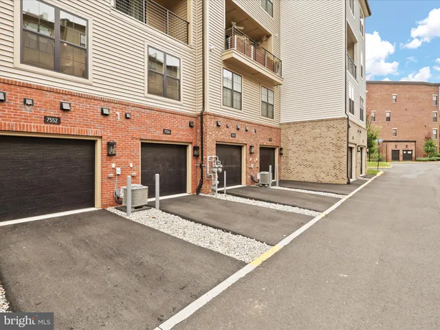 a front view of a building with garage