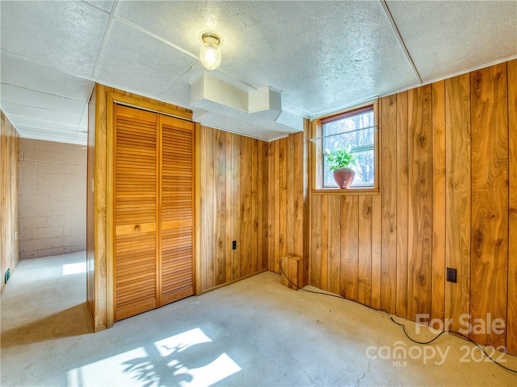 220 Center Pigeon Road Canton, NC 28716 - Photo 21 of 24 a view of a bathroom with wooden walls