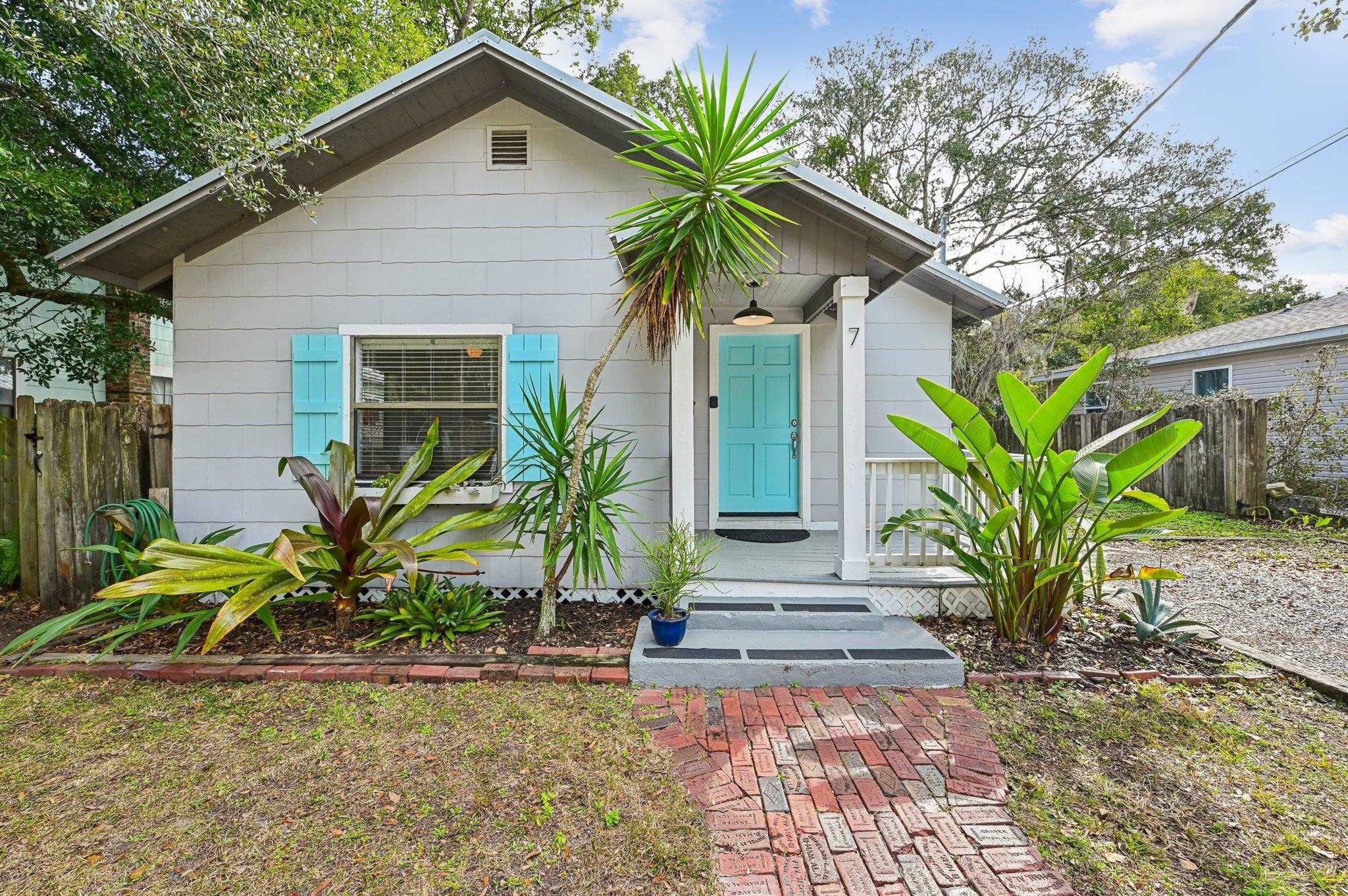 a front view of house with yard and seating