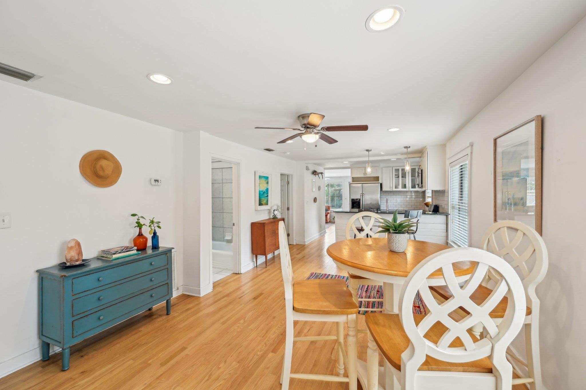 7 Atlantic Avenue St. Augustine, FL 32084 - Photo 15 of 38 a dining room with wooden floor furniture and a chandelier
