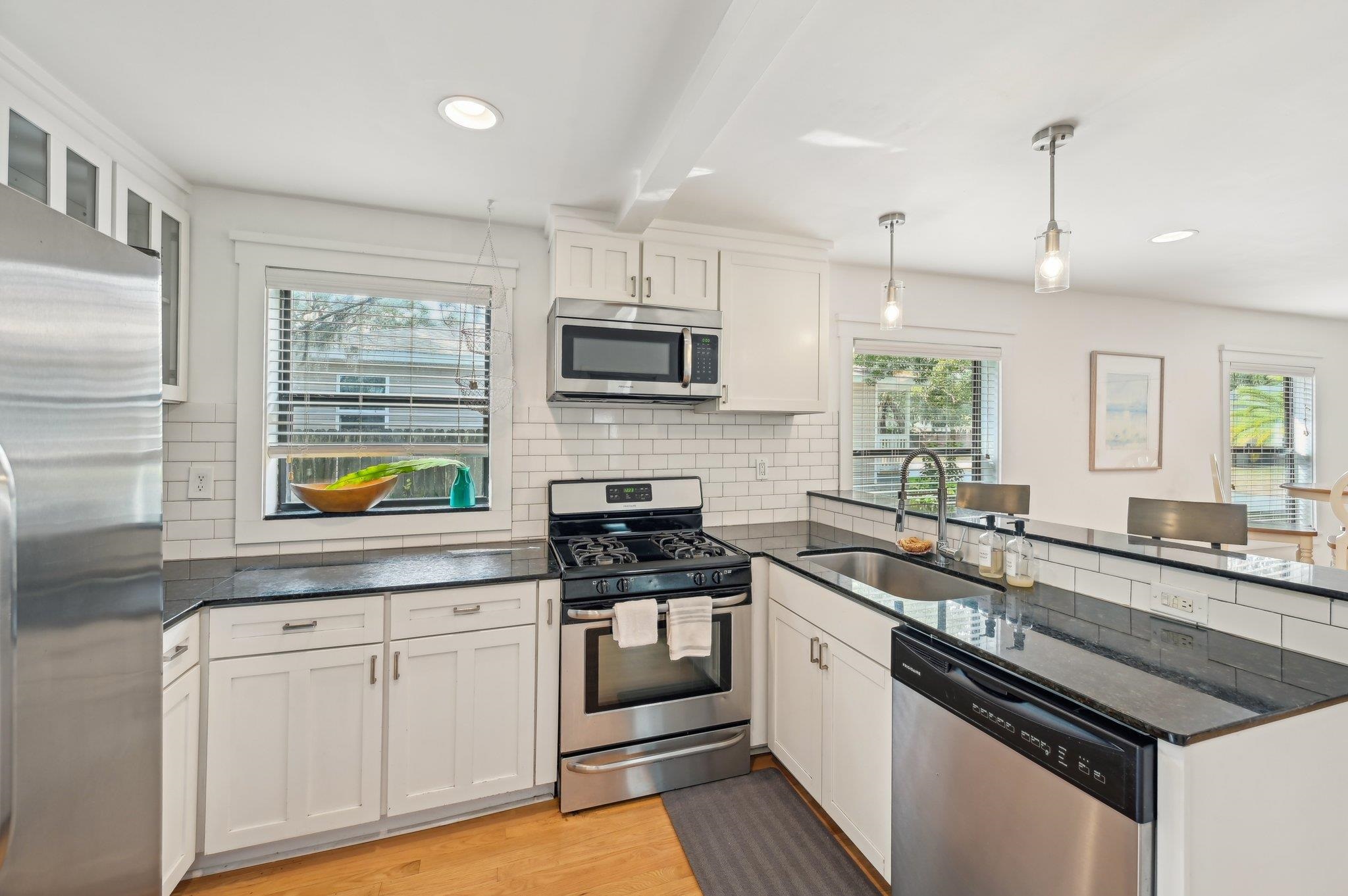 7 Atlantic Avenue St. Augustine, FL 32084 - Photo 17 of 38 a kitchen with granite countertop stainless steel appliances and sink