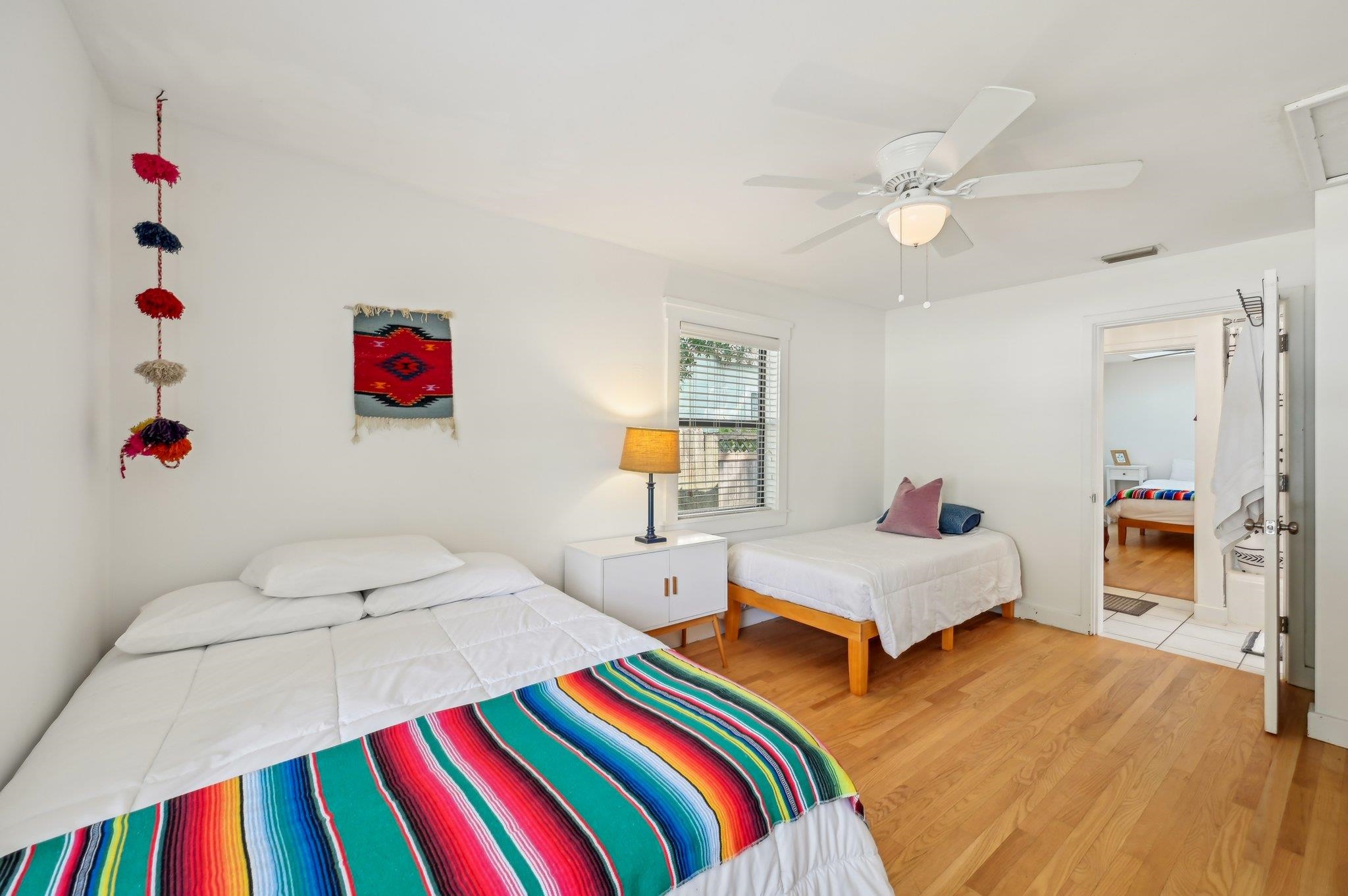 7 Atlantic Avenue St. Augustine, FL 32084 - Photo 23 of 38 a bedroom with a bed and wooden floor