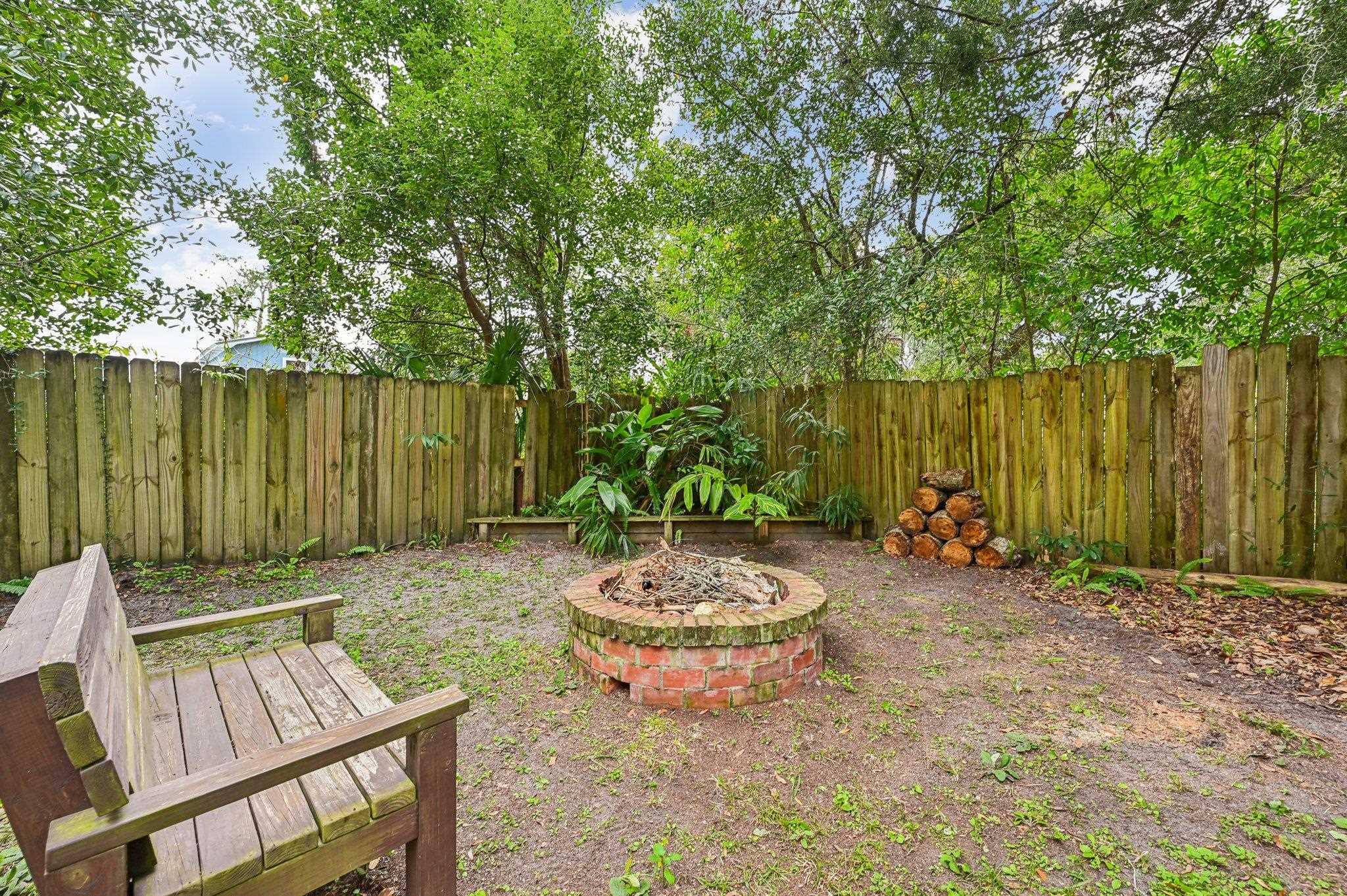 7 Atlantic Avenue St. Augustine, FL 32084 - Photo 33 of 38 a view of a backyard with table and chairs and plants