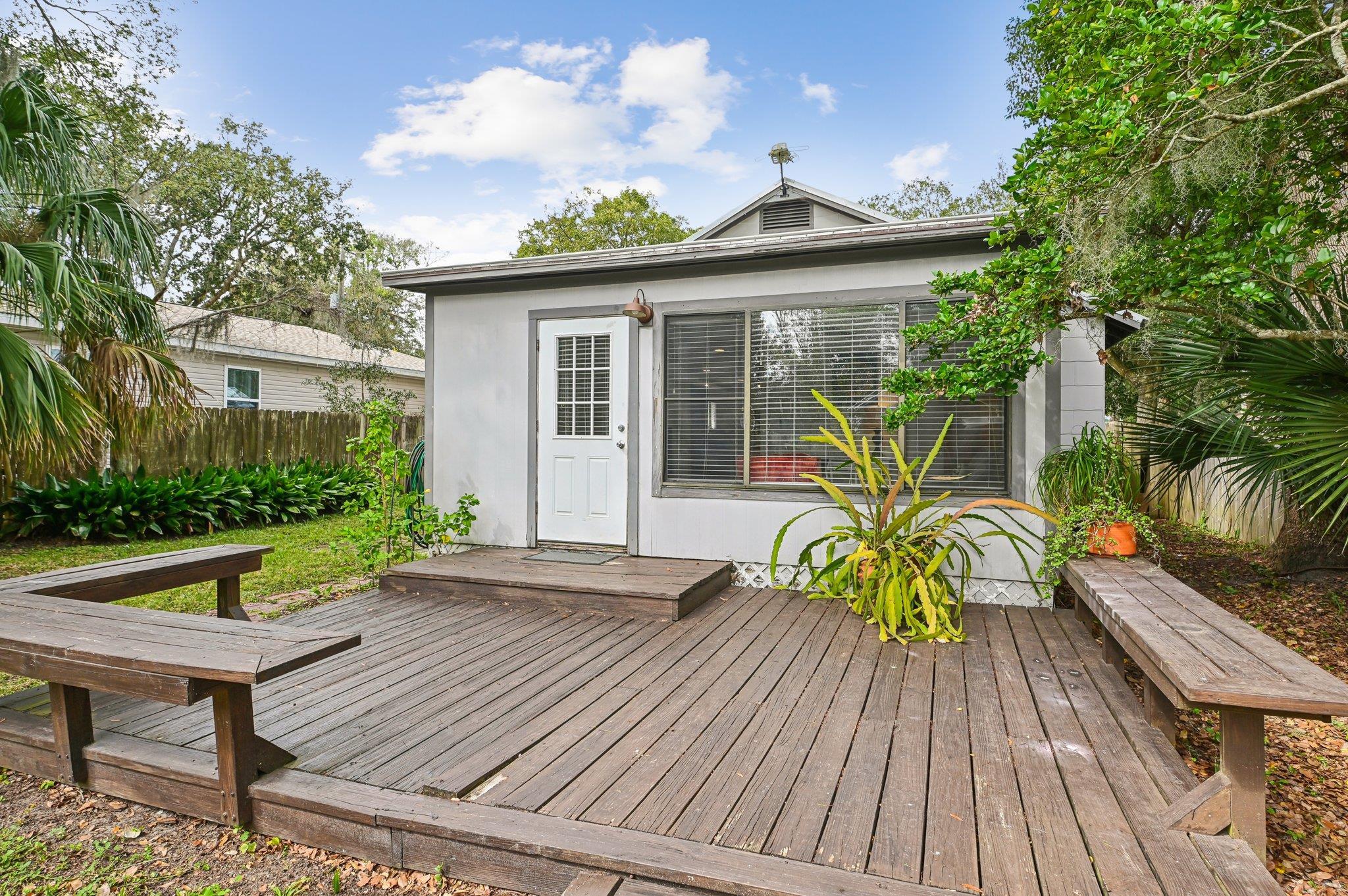7 Atlantic Avenue St. Augustine, FL 32084 - Photo 36 of 38 a view of a wooden chairs and table on the wooden deck