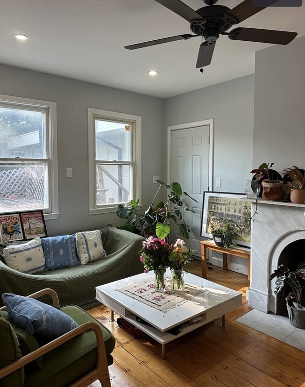 183 Prospect Street, Unit 2 Cambridge, MA 02139 - Photo 2 of 11 a living room with furniture and a fireplace
