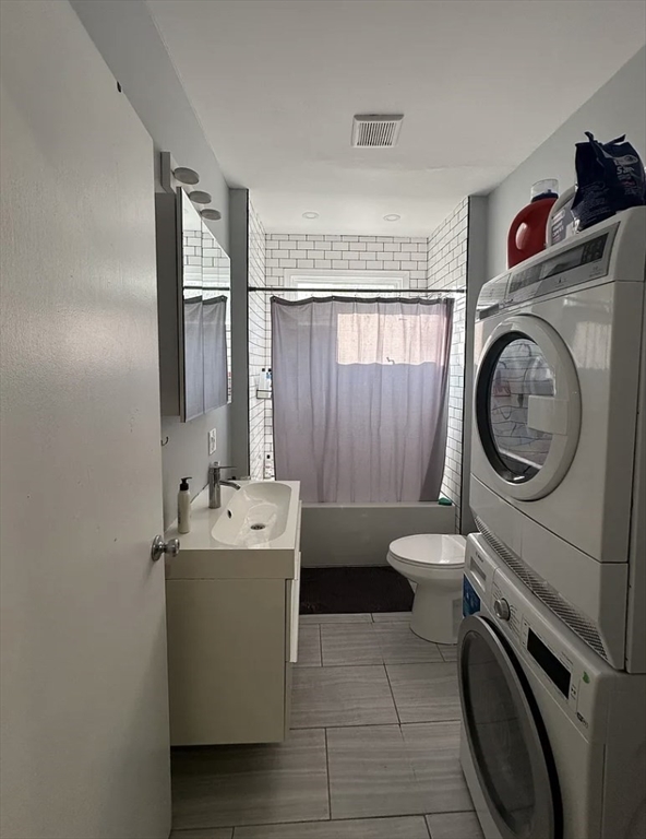 183 Prospect Street, Unit 2 Cambridge, MA 02139 - Photo 5 of 11 a bathroom with a sink a washer and dryer