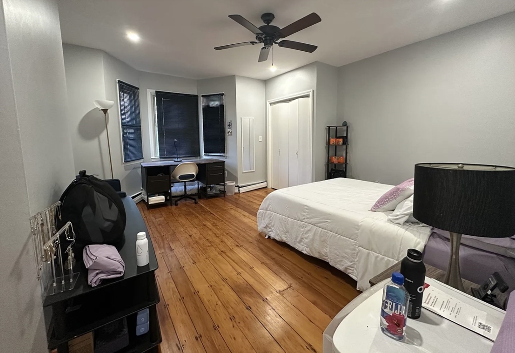 183 Prospect Street, Unit 2 Cambridge, MA 02139 - Photo 9 of 11 a bedroom with a bed and furniture