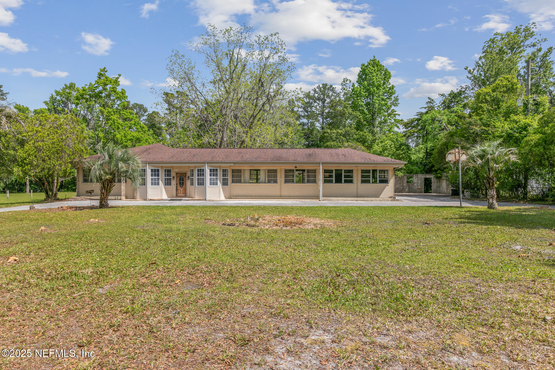 45121 Stratton Road Callahan, FL 32011 - Photo 1 of 24 a view of a house with a garden