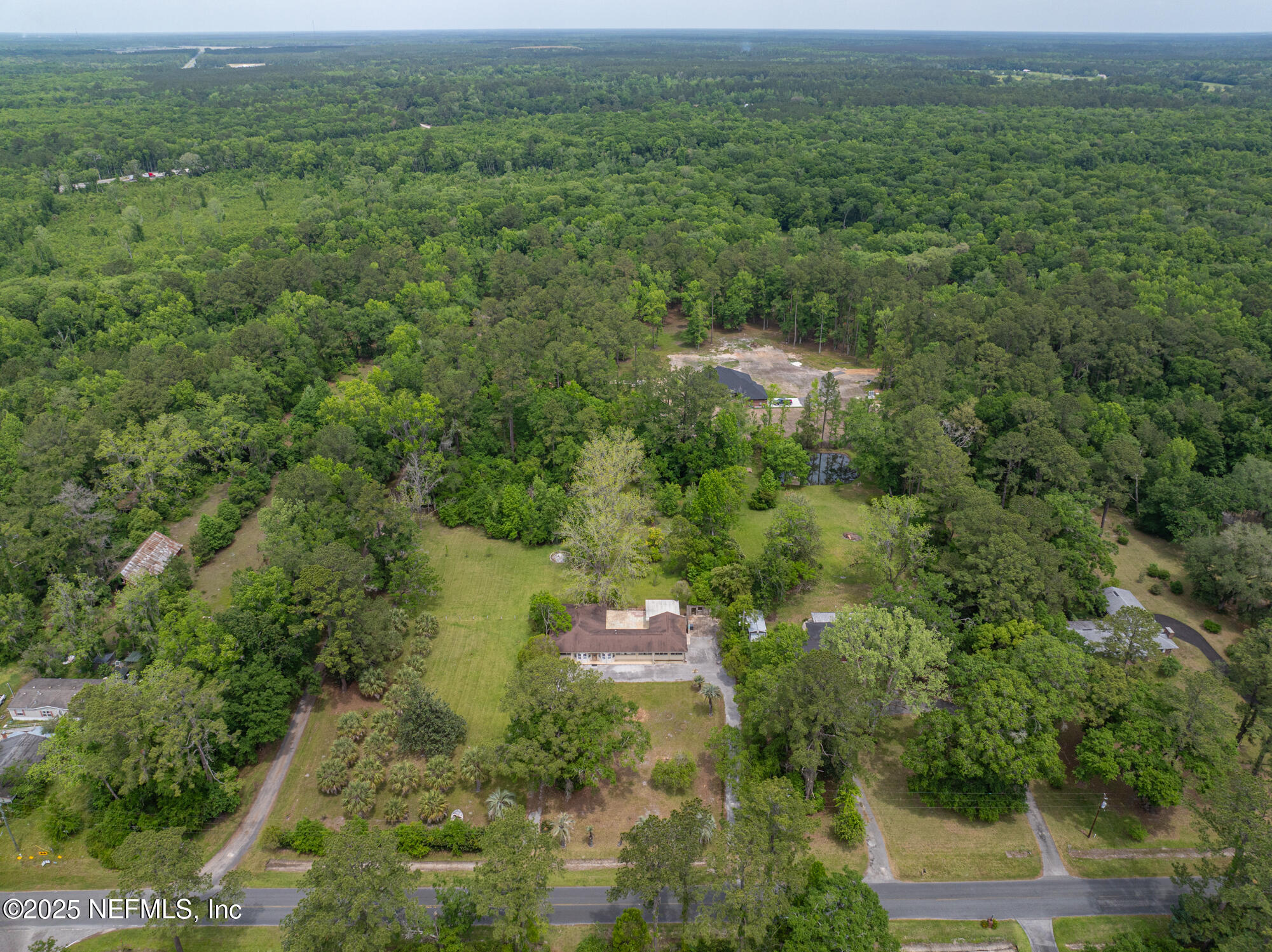 45121 Stratton Road Callahan, FL 32011 - Photo 23 of 24 a view of a forest with a street