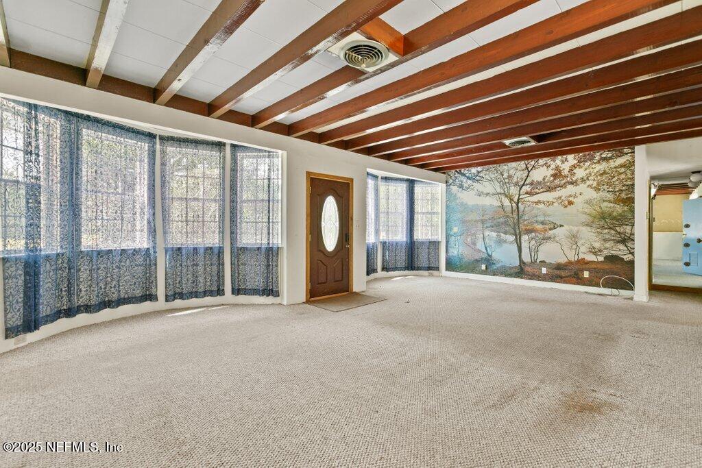45121 Stratton Road Callahan, FL 32011 - Photo 3 of 24 a view of an empty room with a balcony