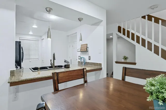 a lobby with furniture and a potted plant