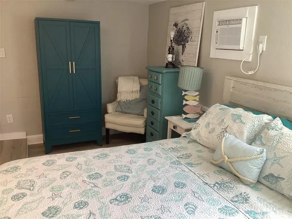 a bedroom with a bed and a view of bathroom